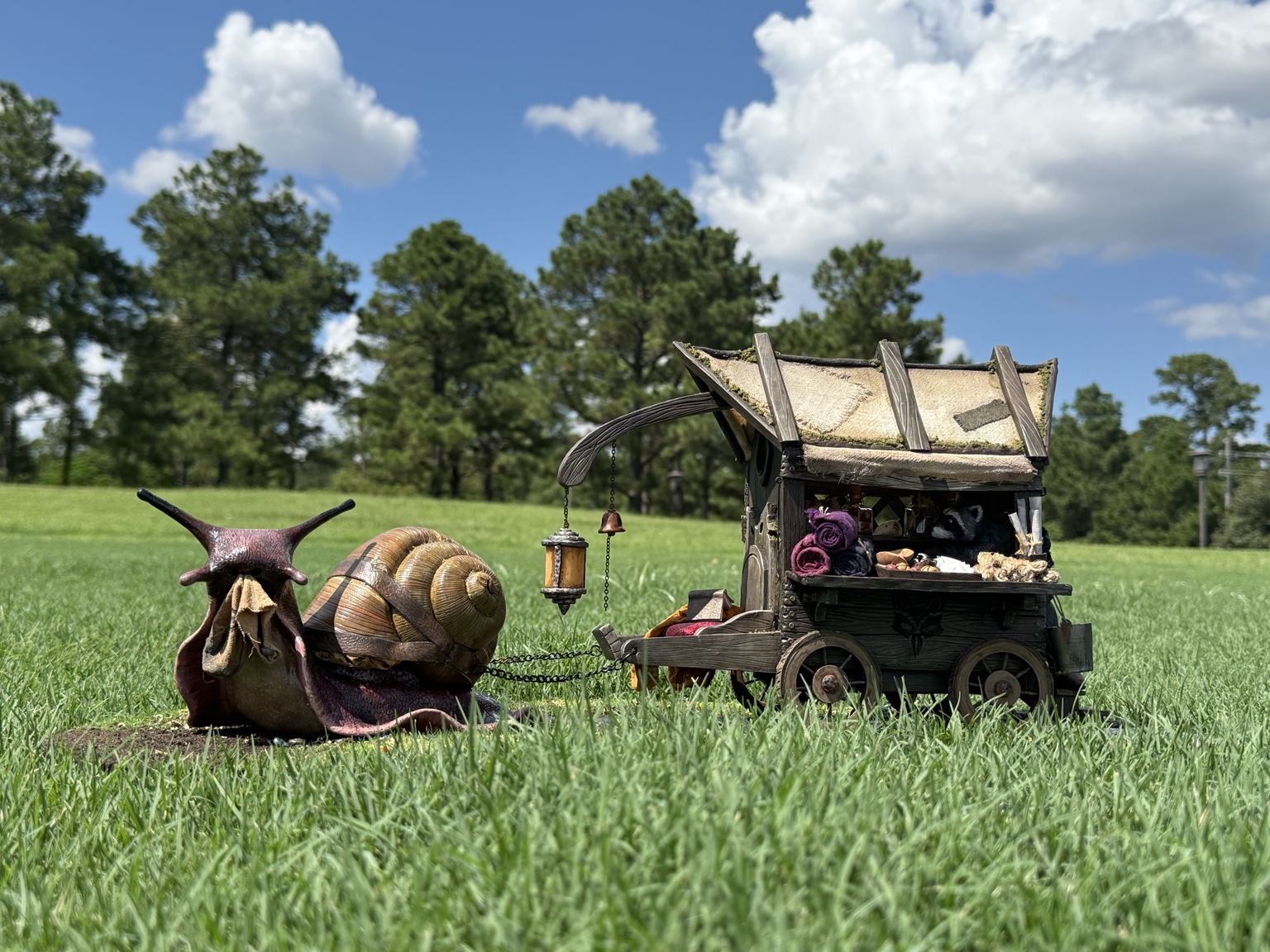 Samuel the giant snail pulling the finished traveling merchant cart